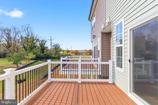 a view of a balcony with wooden floor