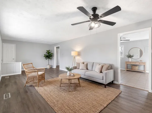 a living room with furniture and a table