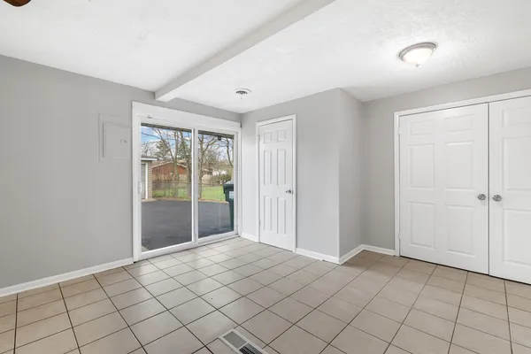 a view of an empty room and window