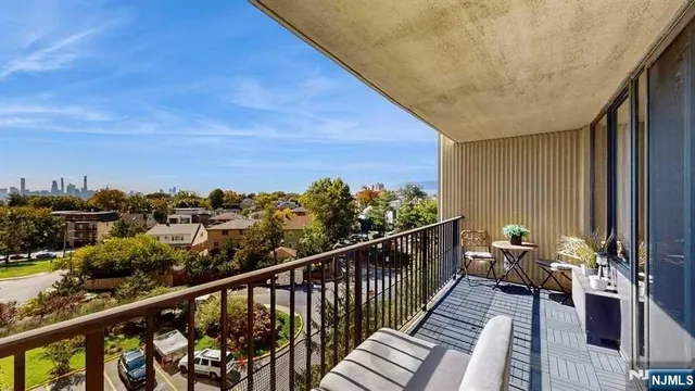 a view of balcony with furniture
