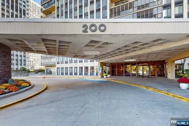 a outdoor space with lots of trees in front of it