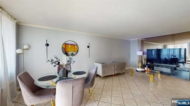 a living room with furniture and a mirror