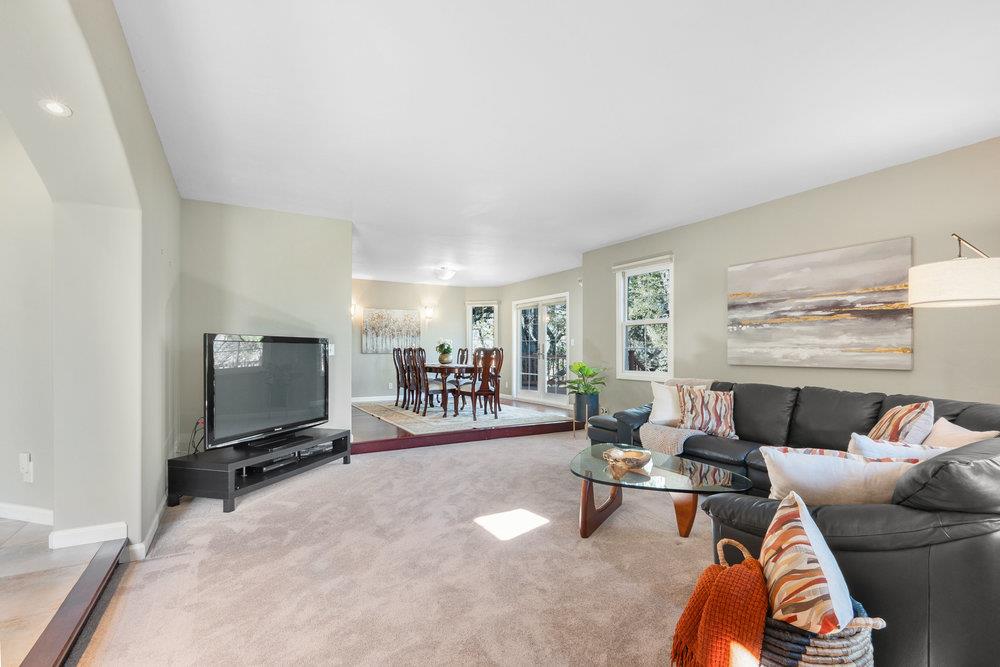9160 Paseo Tranquillo Gilroy, CA 95020 - Photo 13 of 44 a living room with furniture and a flat screen tv