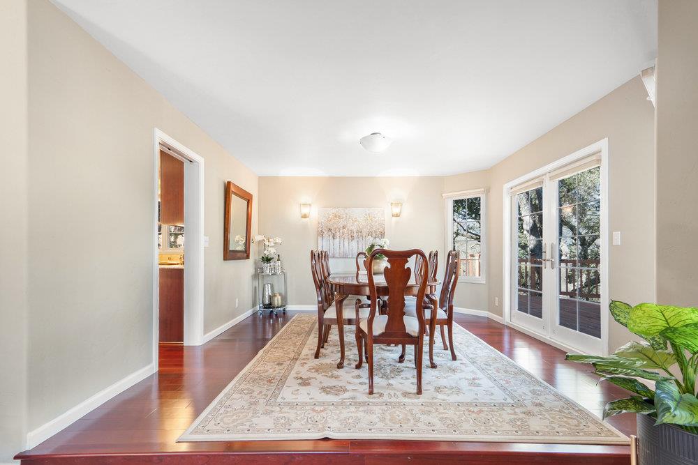 9160 Paseo Tranquillo Gilroy, CA 95020 - Photo 14 of 44 a view of a dining room with furniture window and wooden floor
