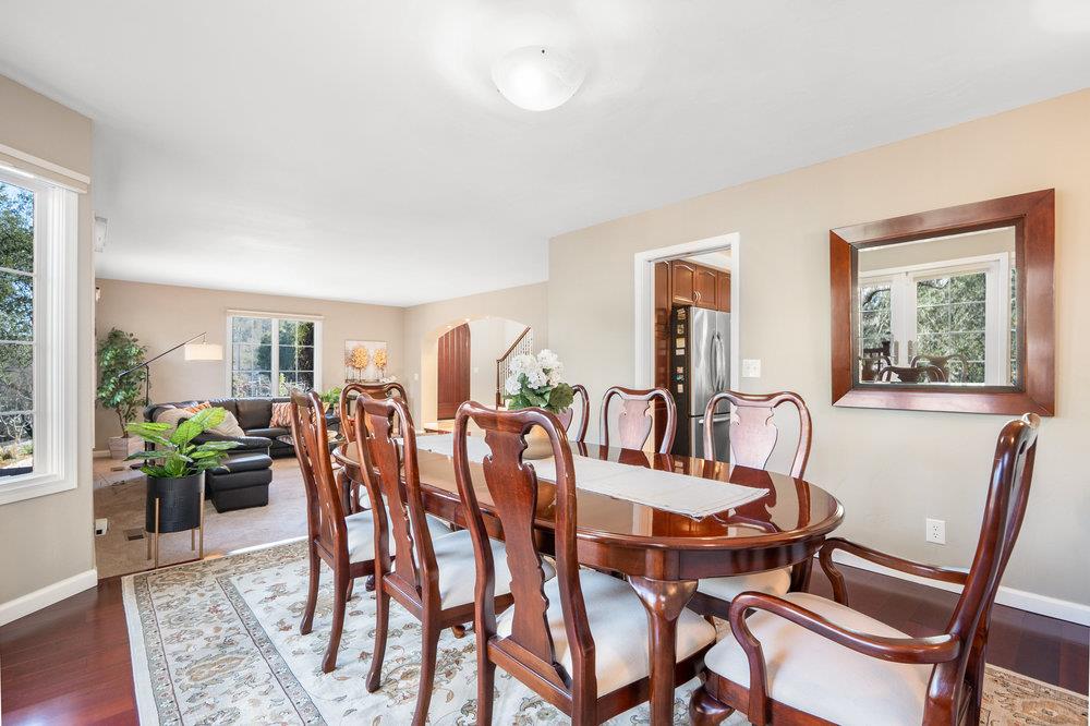 9160 Paseo Tranquillo Gilroy, CA 95020 - Photo 15 of 44 a view of a dining room with furniture window and wooden floor