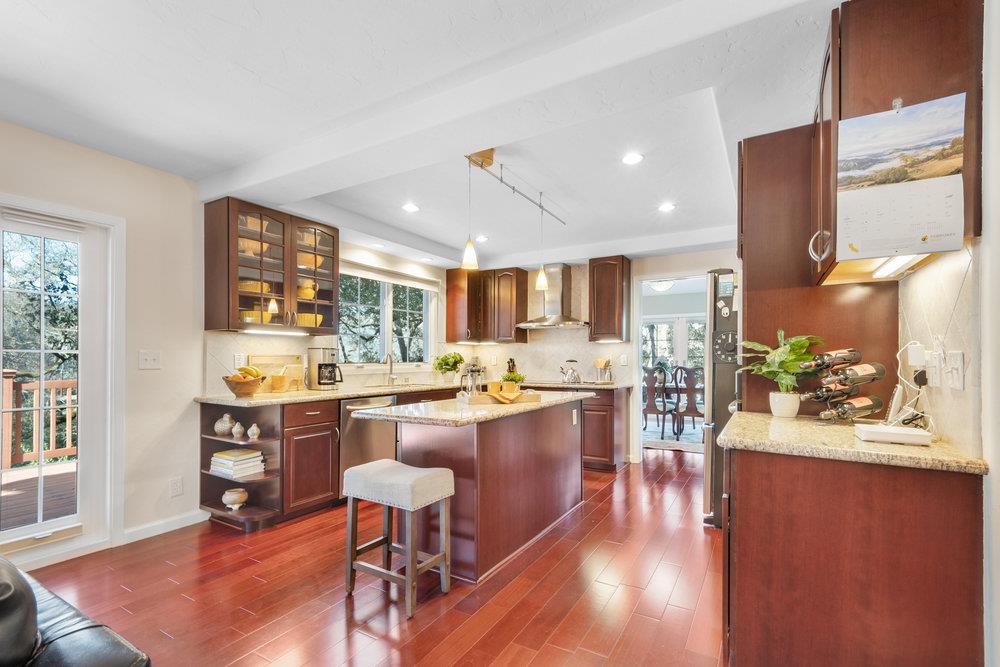 9160 Paseo Tranquillo Gilroy, CA 95020 - Photo 17 of 44 a kitchen with lots of counter top space and painting on the wall