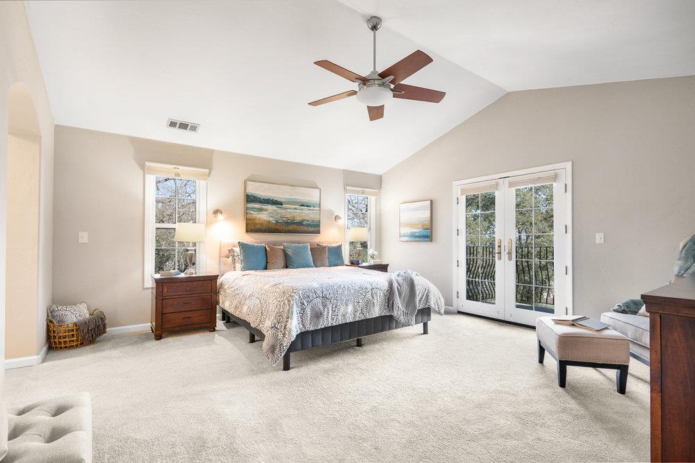 9160 Paseo Tranquillo Gilroy, CA 95020 - Photo 27 of 44 a living room with a bed furniture and a large window