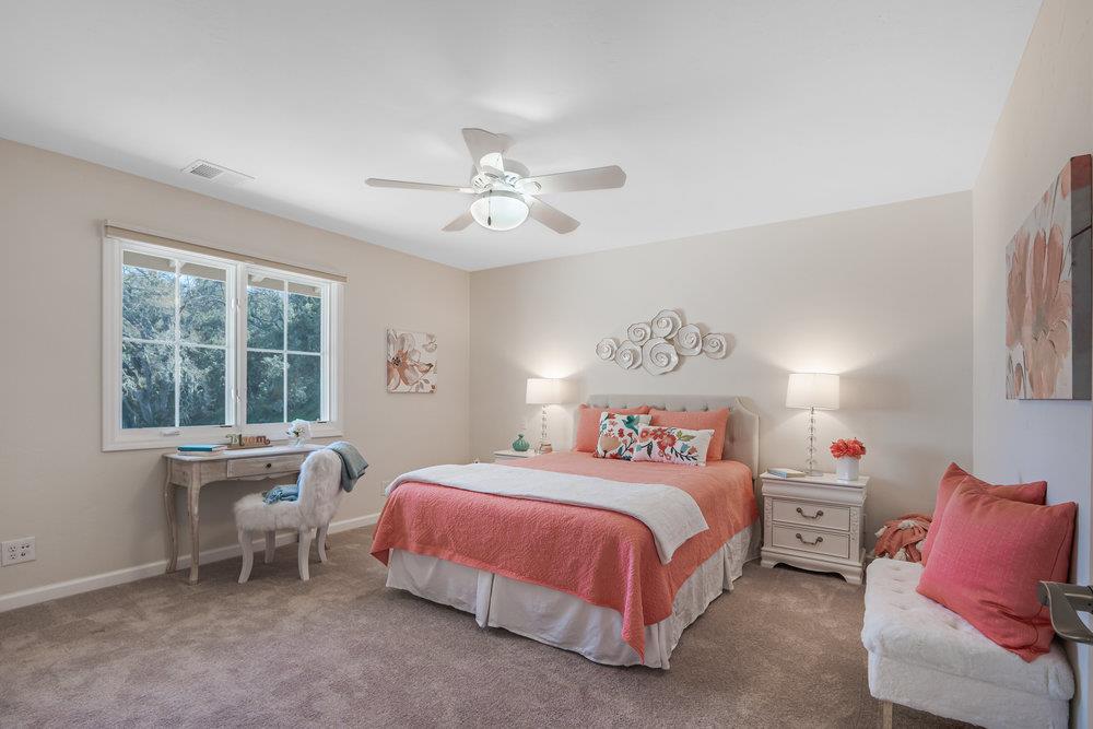9160 Paseo Tranquillo Gilroy, CA 95020 - Photo 36 of 44 a bedroom with a bed and a table in it