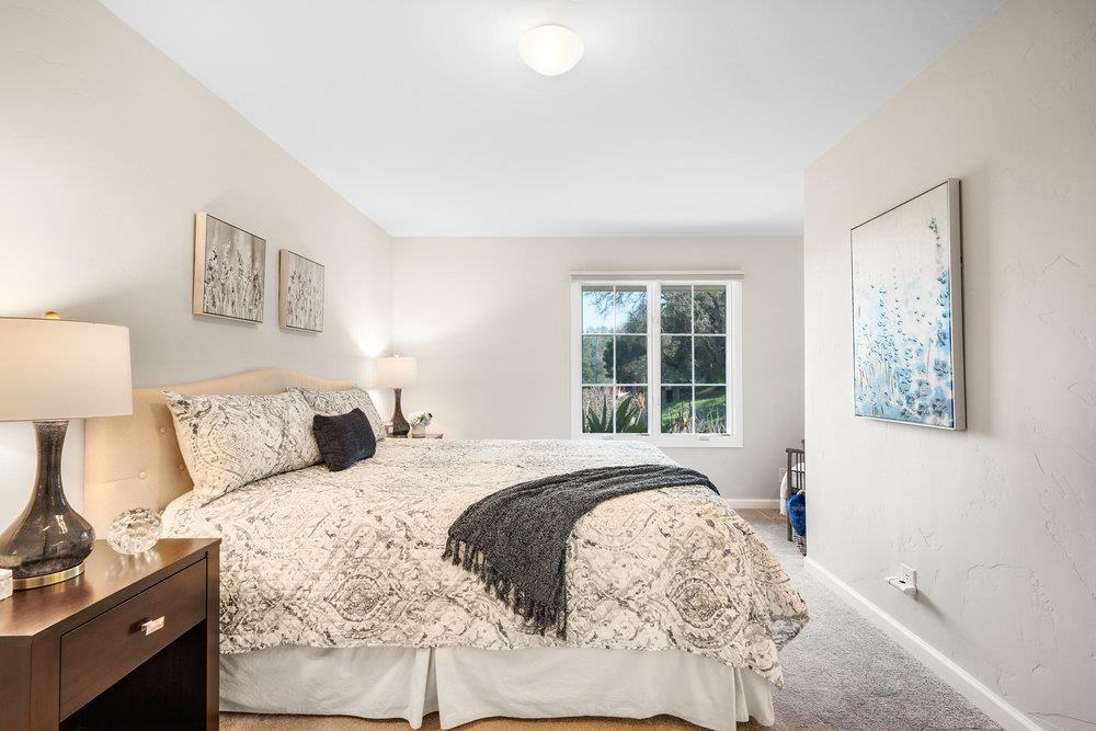 9160 Paseo Tranquillo Gilroy, CA 95020 - Photo 40 of 44 a spacious bedroom with a bed and a window