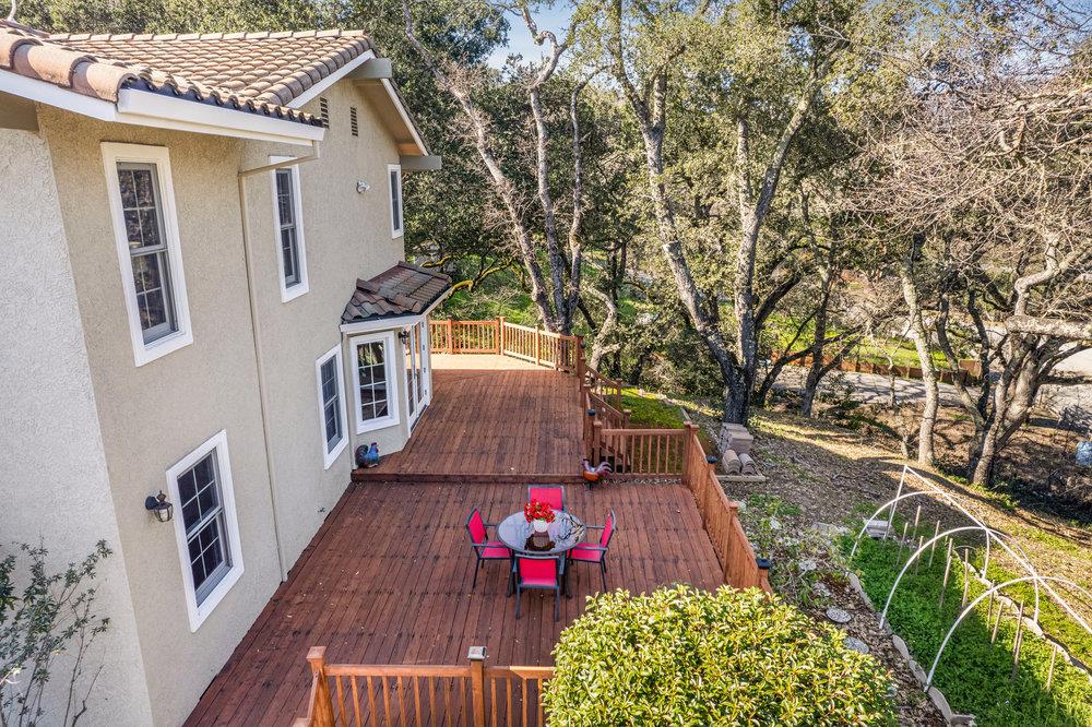 9160 Paseo Tranquillo Gilroy, CA 95020 - Photo 5 of 44 a view of a deck with shrubs