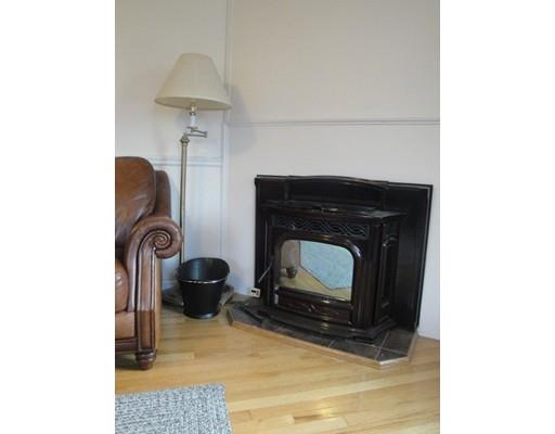 67 Mashapaug Road Sturbridge, MA 01566 - Photo 12 of 29 a room with a fireplace and a rug