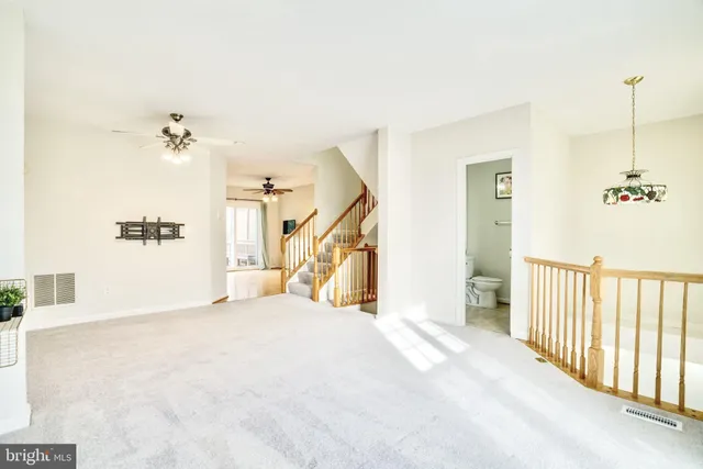 a view of a bedroom with stairs and a bathtub