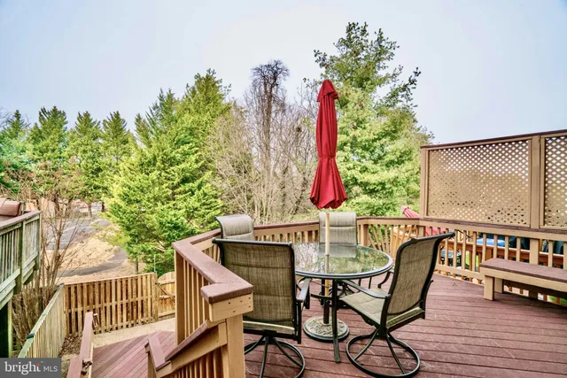 a view of a chairs and table on the deck