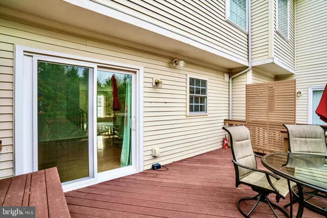 a view of a two chairs in the balcony