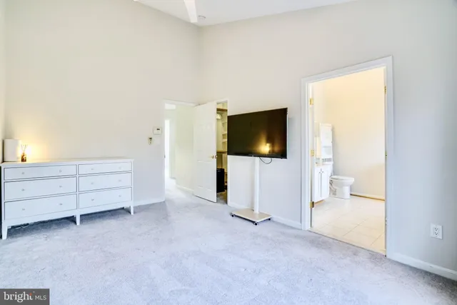 a living room with furniture and flat screen tv