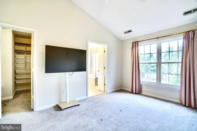 a view of livingroom with furniture and windows