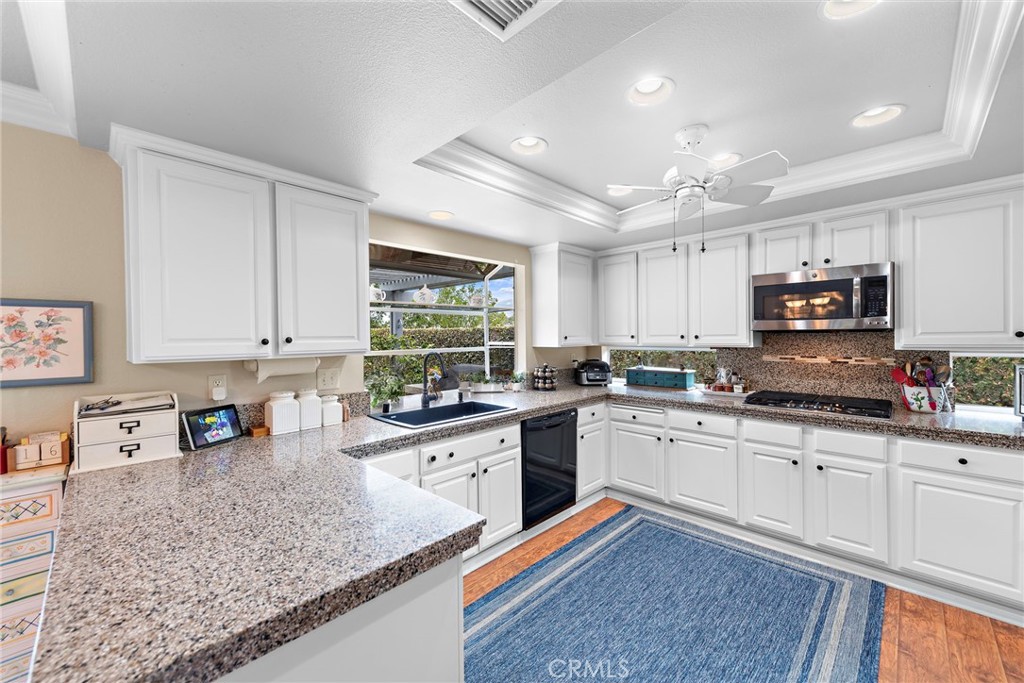 28811 Walnut Grove Mission Viejo, CA 92692 - Photo 12 of 48 a kitchen with sink cabinets and window