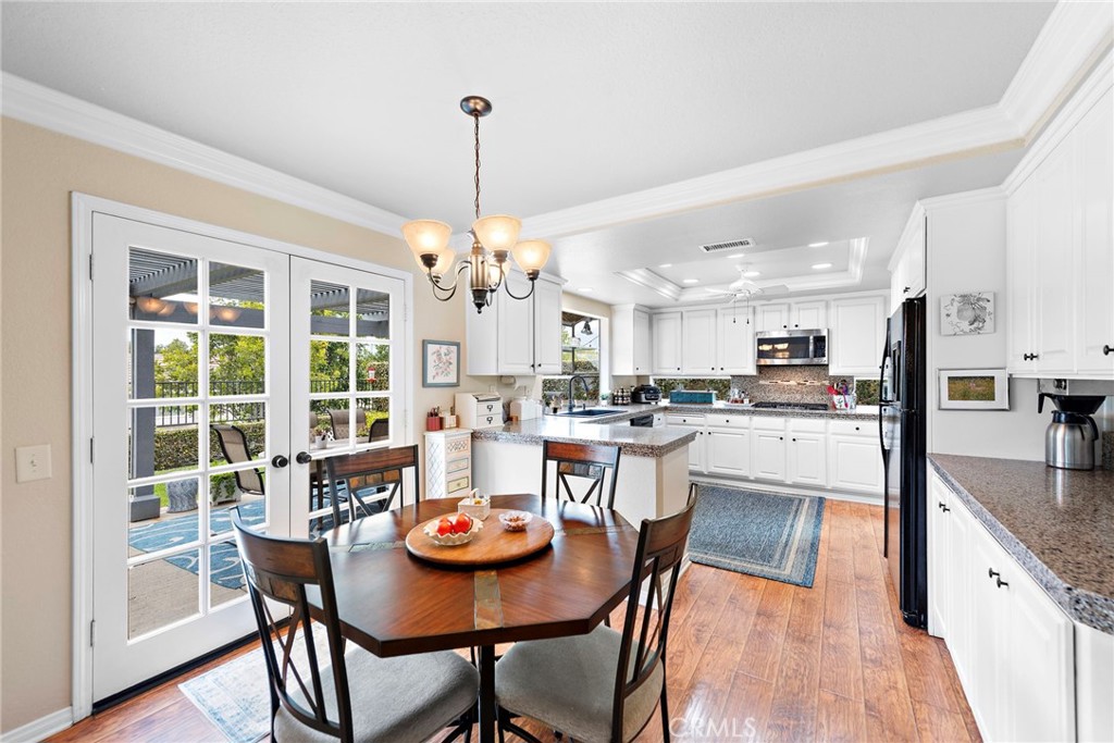 28811 Walnut Grove Mission Viejo, CA 92692 - Photo 14 of 48 a view of a dining room and livingroom view kitchen and chandelier