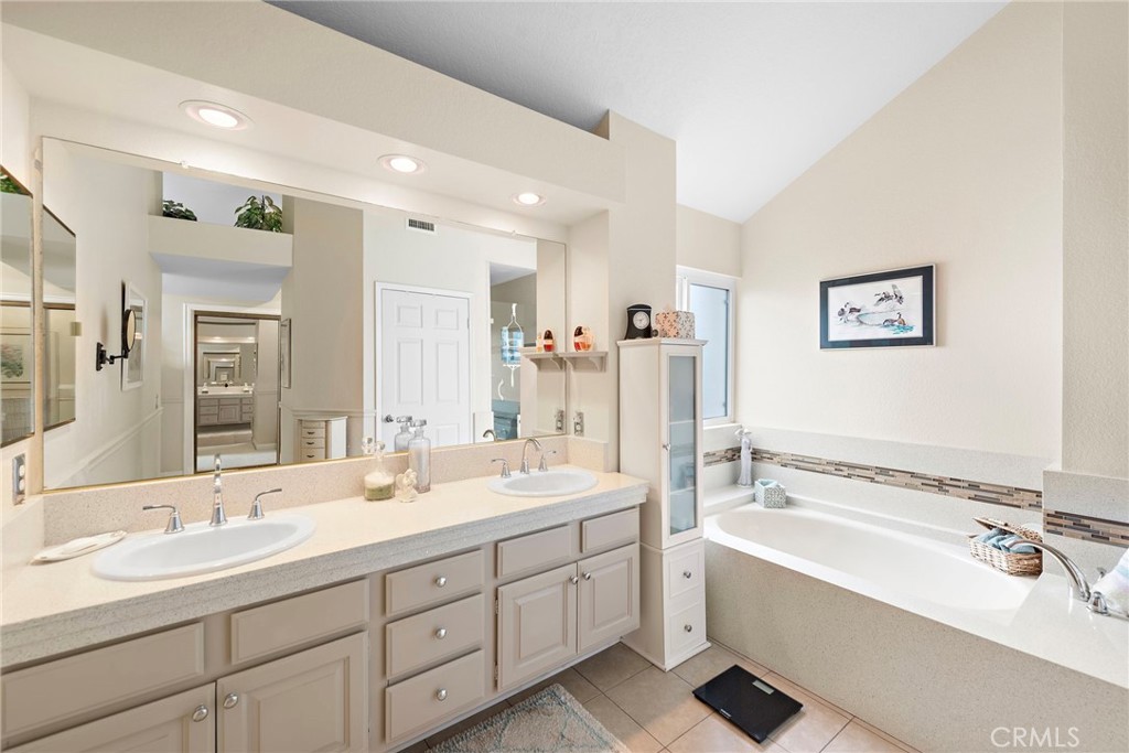 28811 Walnut Grove Mission Viejo, CA 92692 - Photo 19 of 48 a spacious bathroom with a double vanity sink mirror double and bathtub