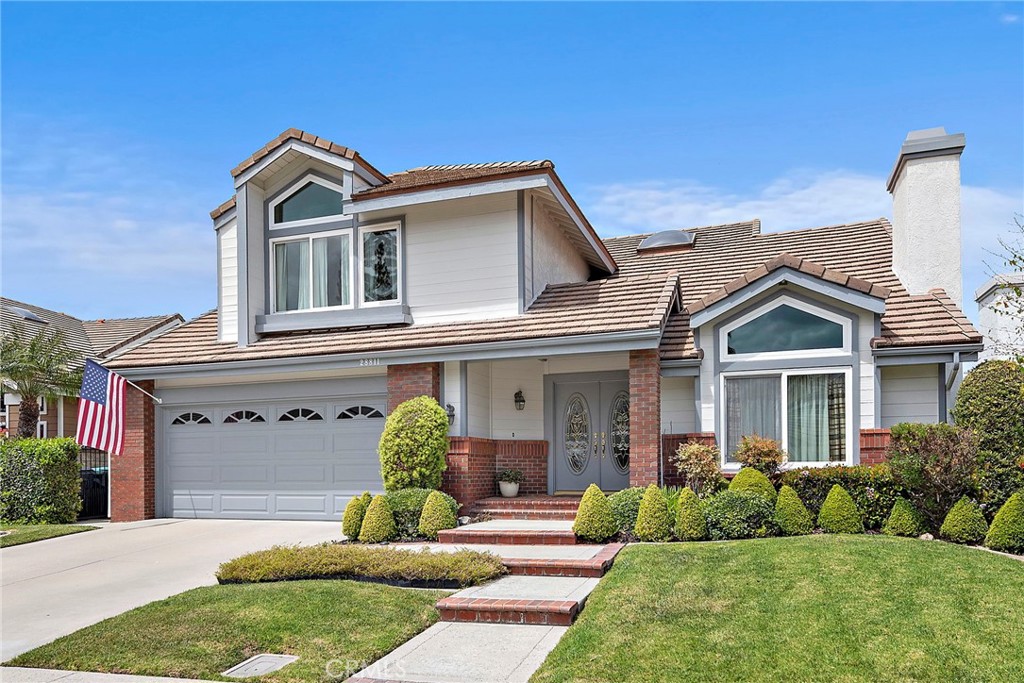 28811 Walnut Grove Mission Viejo, CA 92692 - Photo 2 of 48 a front view of a house with a yard