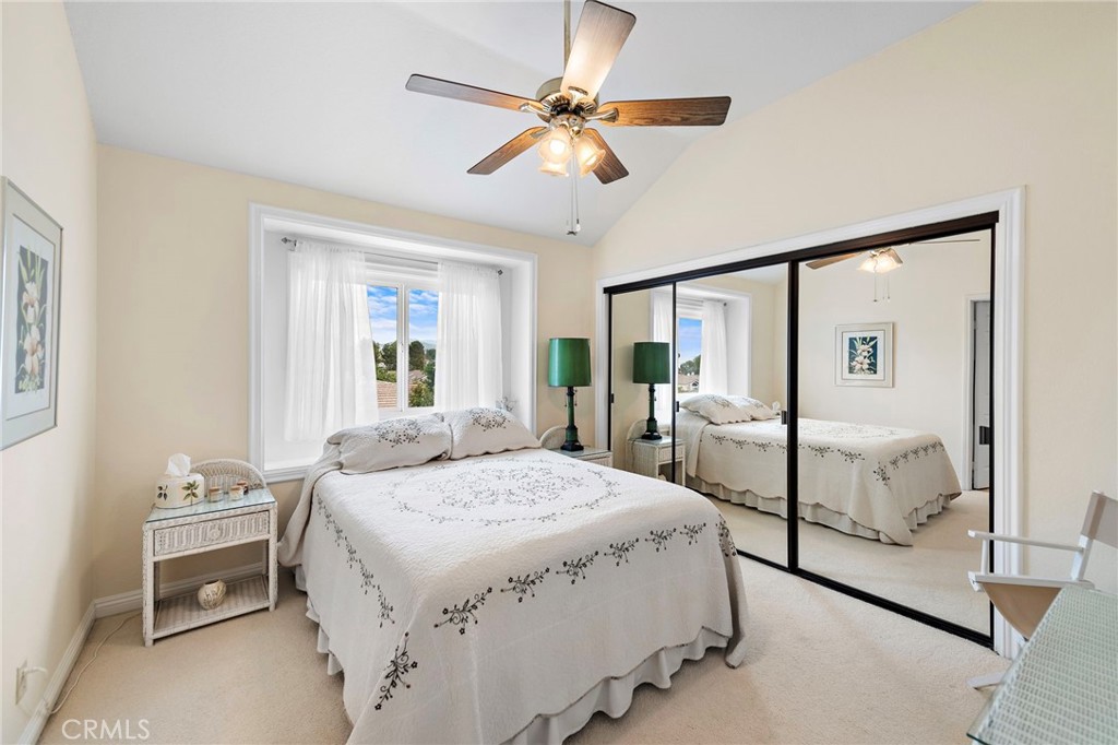 28811 Walnut Grove Mission Viejo, CA 92692 - Photo 21 of 48 a bedroom with a bed and a chandelier