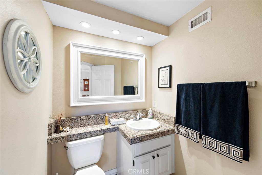 28811 Walnut Grove Mission Viejo, CA 92692 - Photo 24 of 48 a bathroom with a granite countertop sink and a mirror