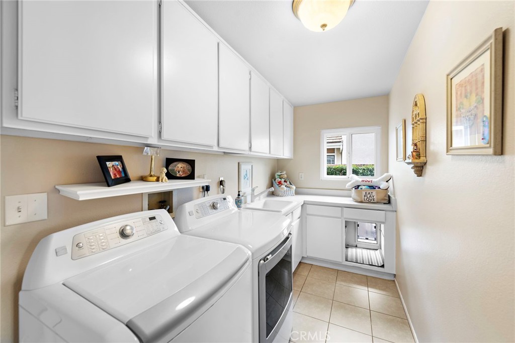 28811 Walnut Grove Mission Viejo, CA 92692 - Photo 25 of 48 a kitchen with a sink a stove and cabinets