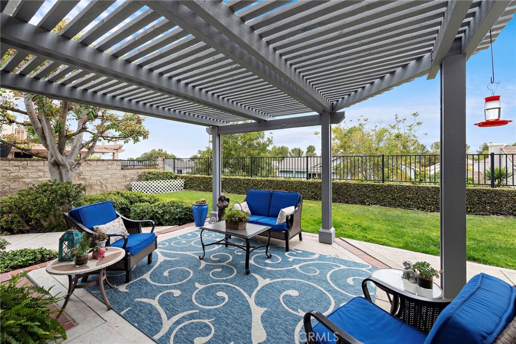 28811 Walnut Grove Mission Viejo, CA 92692 - Photo 27 of 48 a view of a patio with chairs and floor to ceiling window with garden view