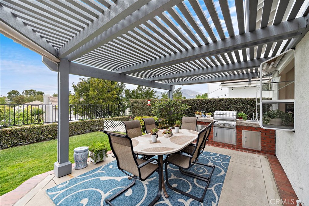 28811 Walnut Grove Mission Viejo, CA 92692 - Photo 32 of 48 a view of a patio with a table chairs and backyard