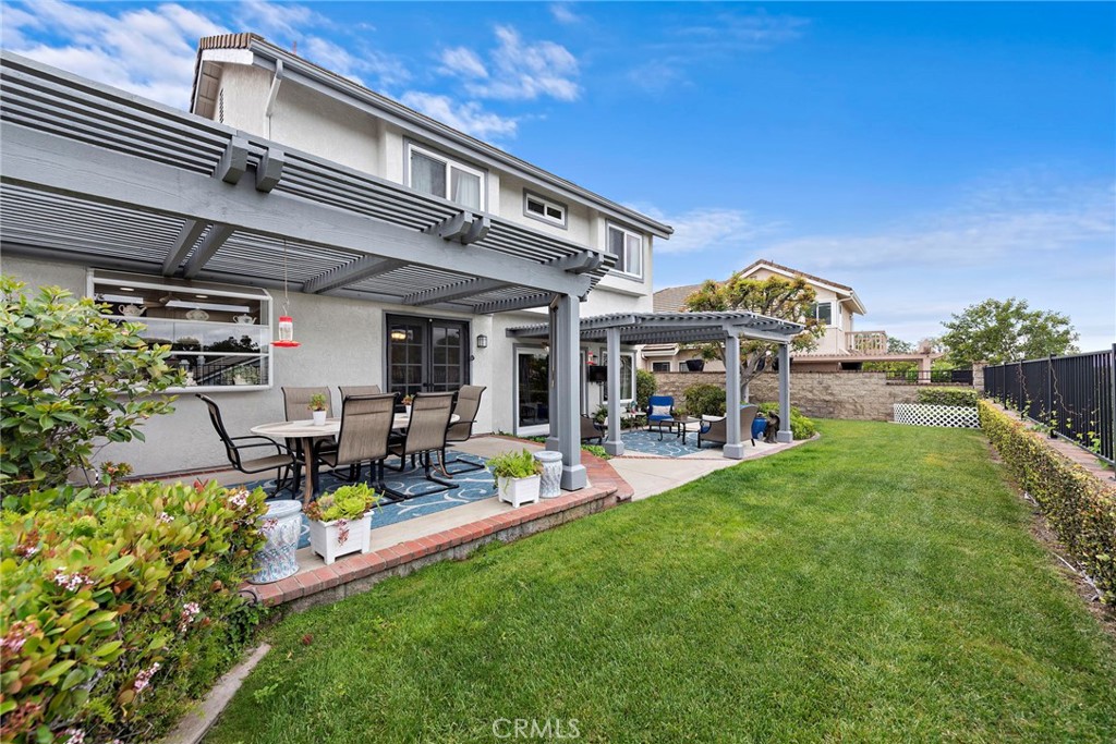28811 Walnut Grove Mission Viejo, CA 92692 - Photo 33 of 48 a front view of a house with garden and sitting area