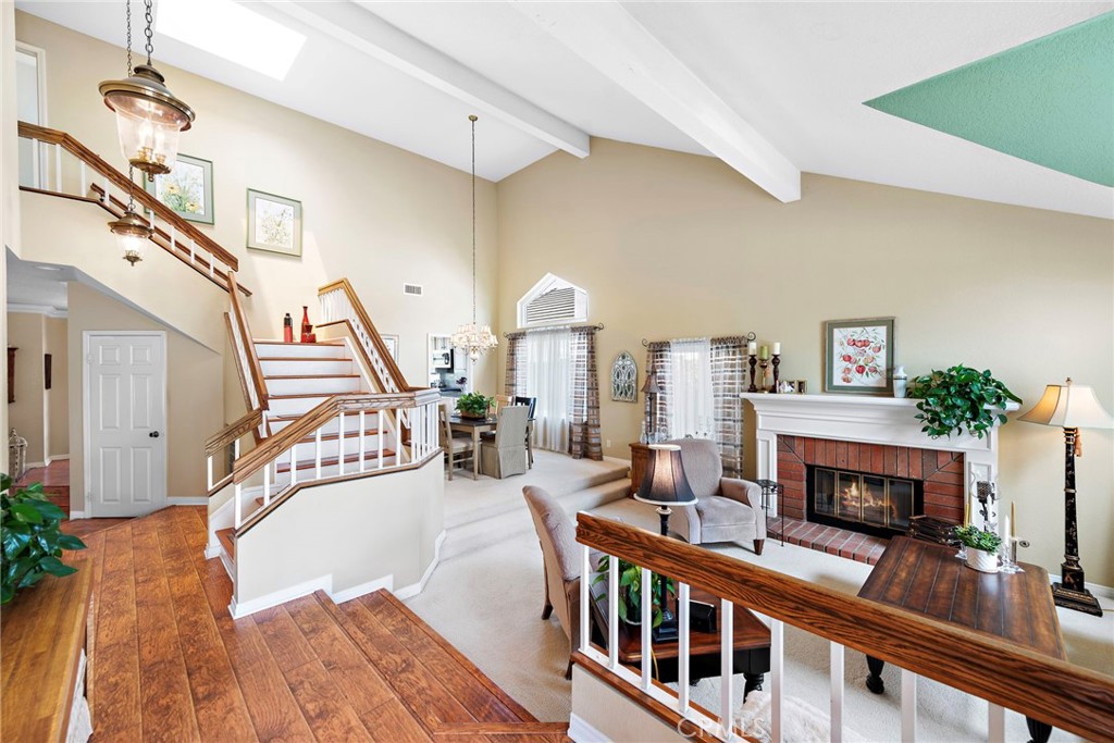 28811 Walnut Grove Mission Viejo, CA 92692 - Photo 4 of 48 a living room with furniture a fireplace and a potted plant