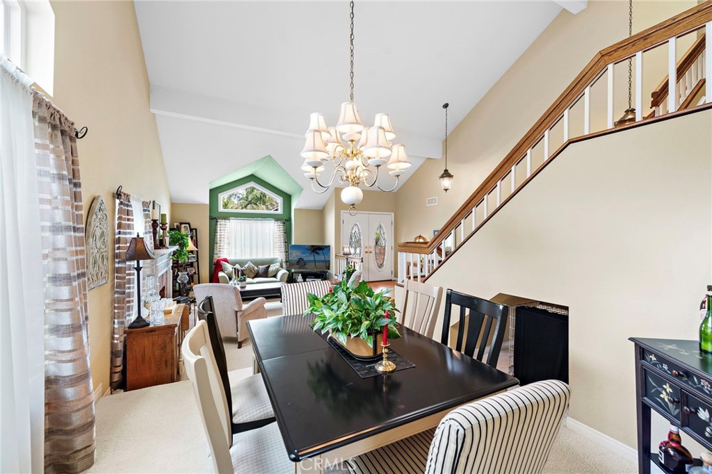 28811 Walnut Grove Mission Viejo, CA 92692 - Photo 9 of 48 a view of a dining room with furniture a chandelier and wooden floor