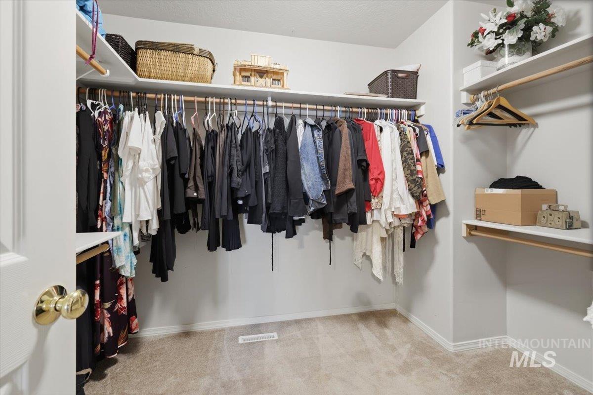 5002 Northrup Way Caldwell, ID 83607 - Photo 22 of 38 Walk in closet with light colored carpet