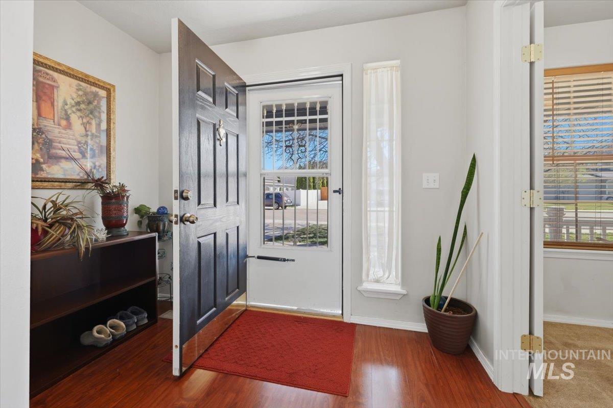 5002 Northrup Way Caldwell, ID 83607 - Photo 5 of 38 Foyer entrance featuring wood finished floors and baseboards