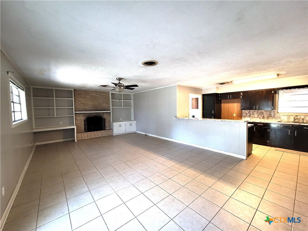 1006 Blyth Road Victoria, TX 77904 - Photo 5 of 7 a view of a kitchen with a sink and a stove top oven