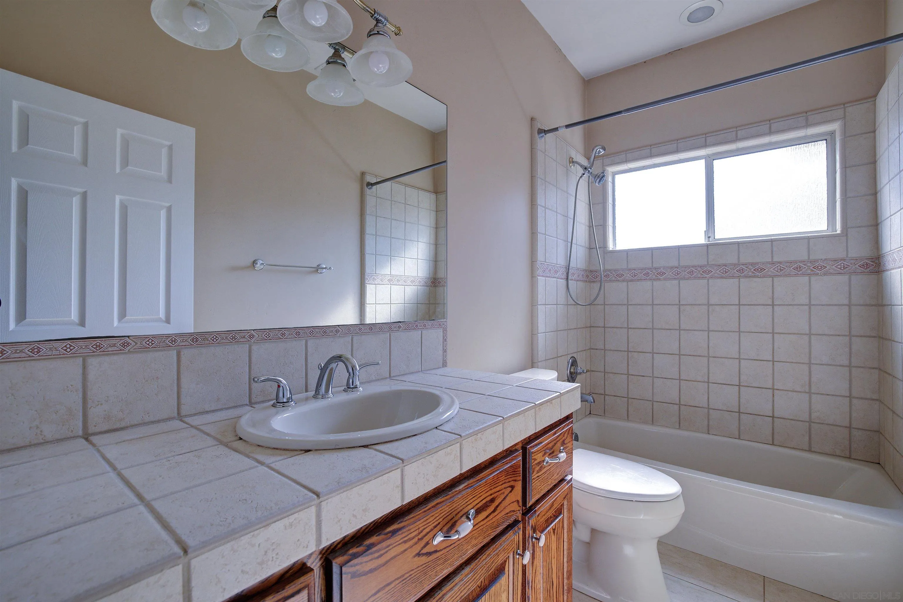 31363 Ahern Ranch Road Valley Center, CA 92082 - Photo 38 of 48 a bathroom with a sink a toilet a mirror and shower