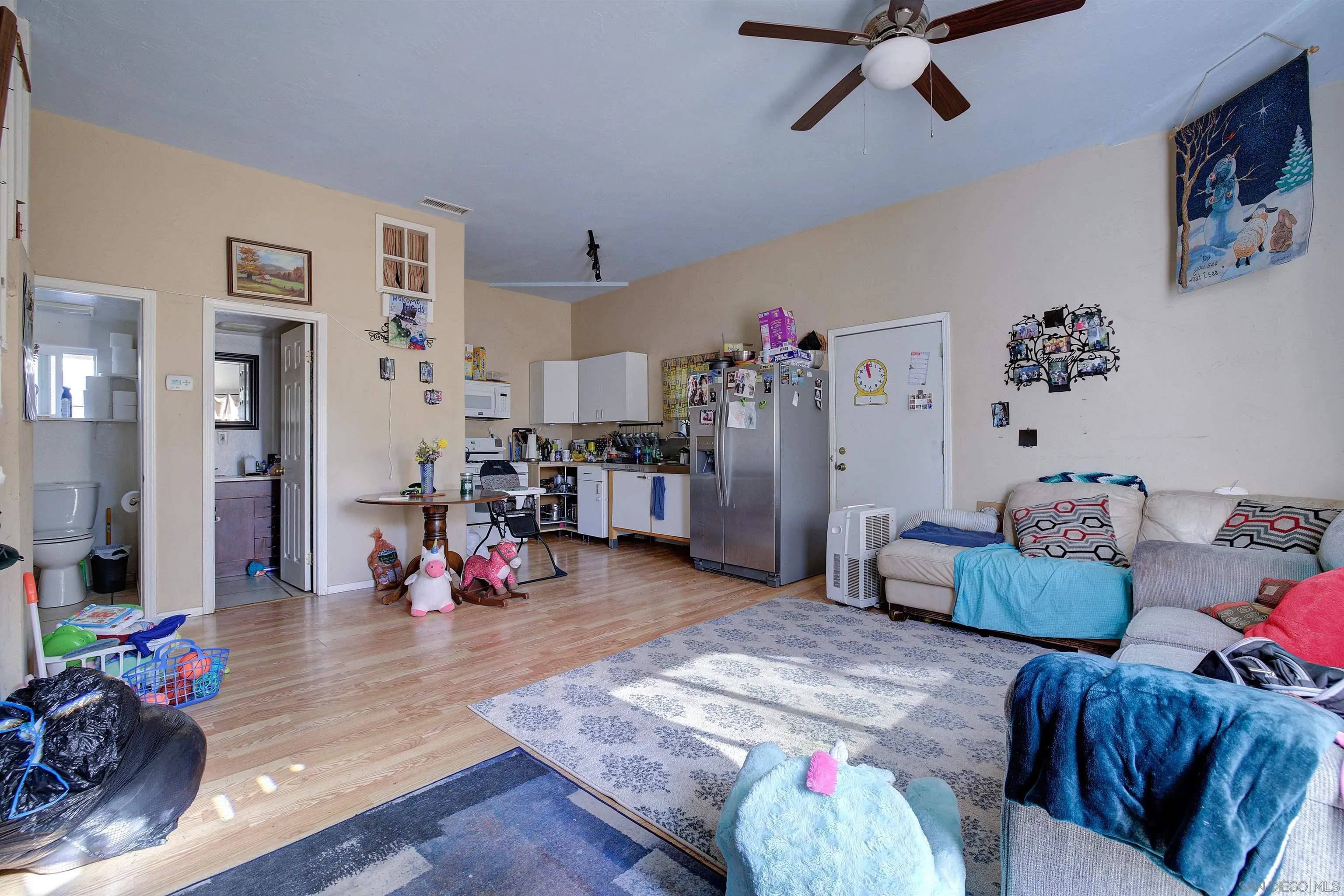 31363 Ahern Ranch Road Valley Center, CA 92082 - Photo 41 of 48 a living room with furniture and a wooden floor
