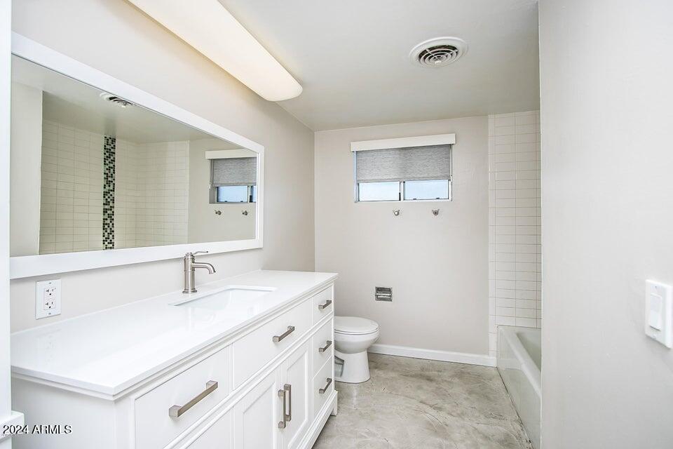 1630 East Georgia Avenue, Unit 208 Phoenix, AZ 85016 - Photo 16 of 23 a bathroom with a sink a toilet and shower