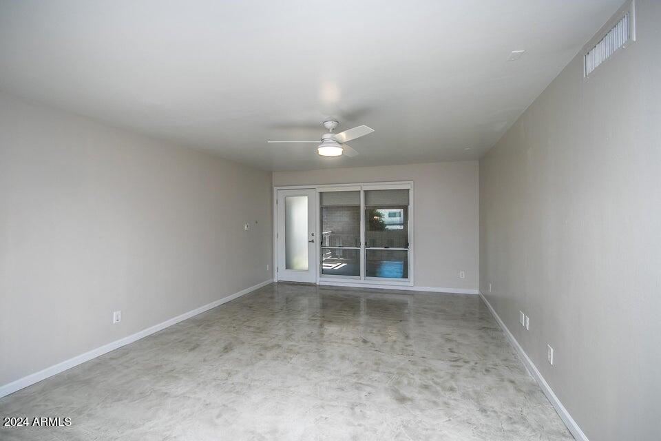 1630 East Georgia Avenue, Unit 208 Phoenix, AZ 85016 - Photo 3 of 23 an empty room with windows and entrance