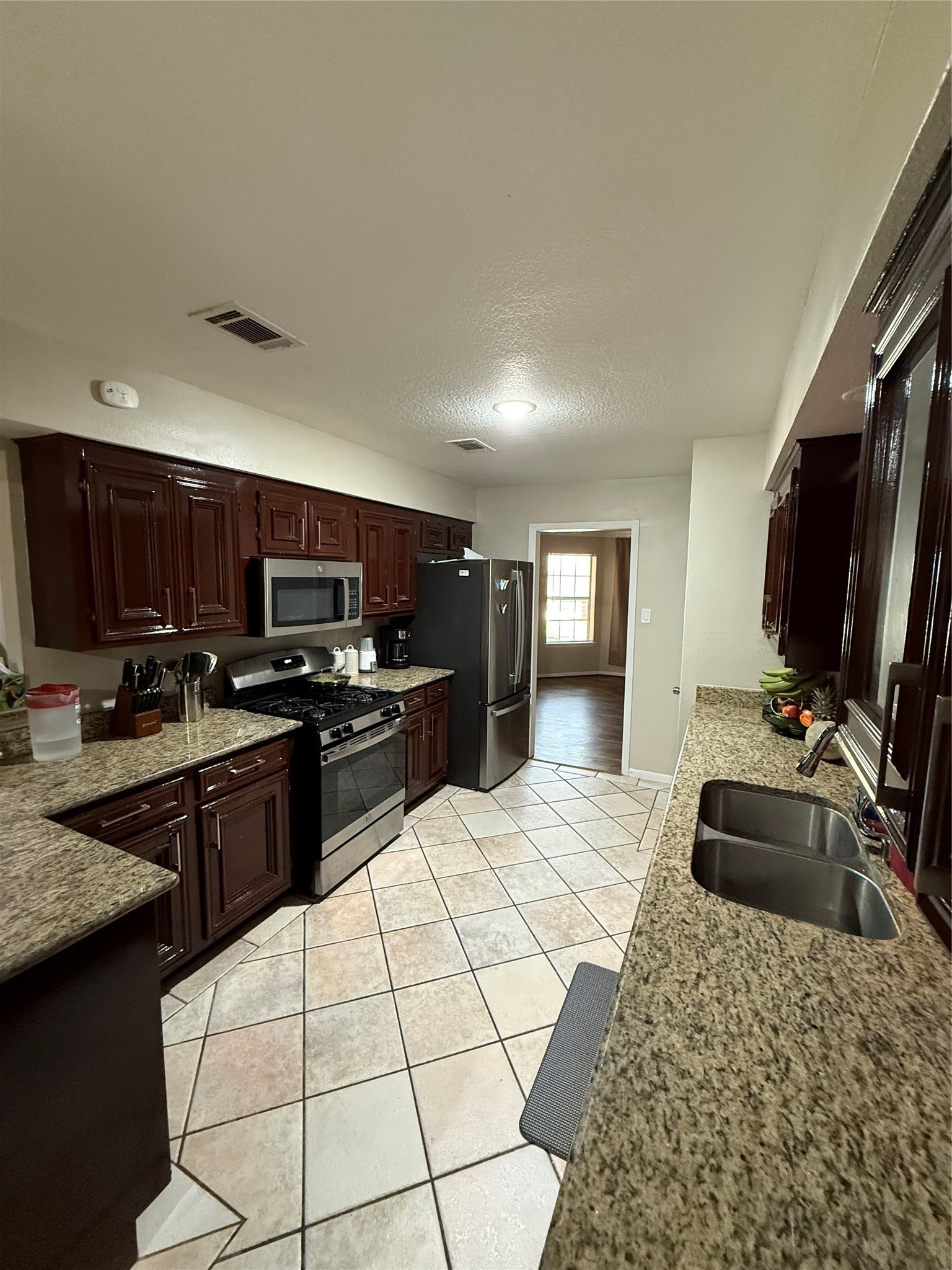 3103 Pine Dust Lane Spring, TX 77373 - Photo 19 of 29 a kitchen with a sink appliances and cabinets