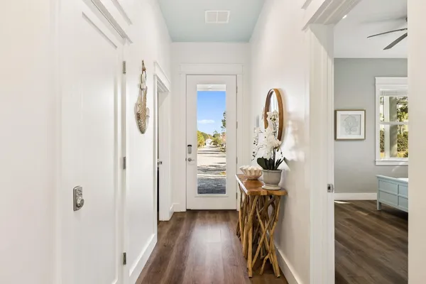 a kitchen with stainless steel appliances granite countertop a stove and a wooden floors