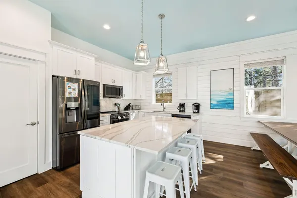 a bedroom with a bed and a ceiling fan