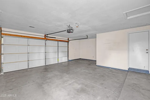 an empty room with a empty space and windows