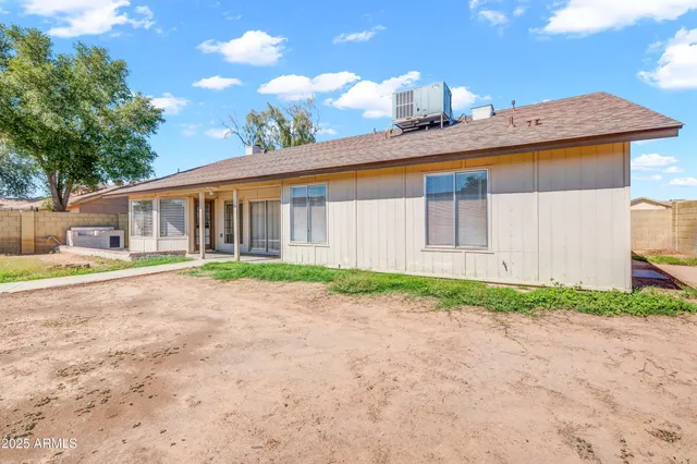 a view of a brick house with a large window