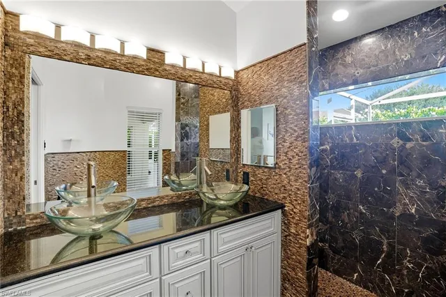 a bathroom with a sink and mirror