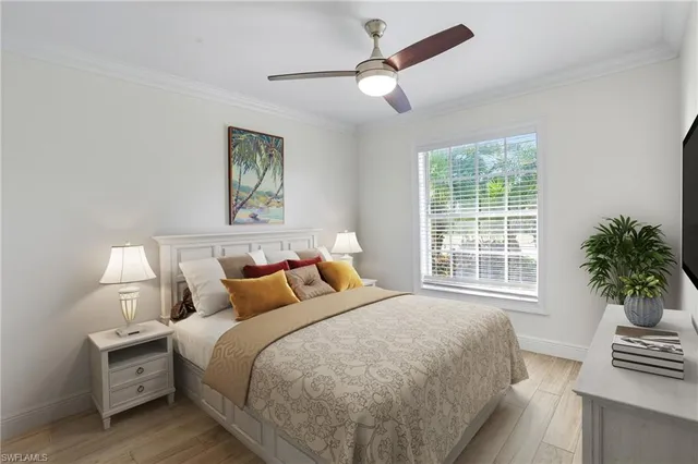 a bedroom with bed and a window