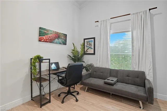 a living room with furniture and a window