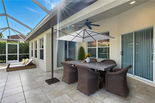 a view of a patio with a table and chairs