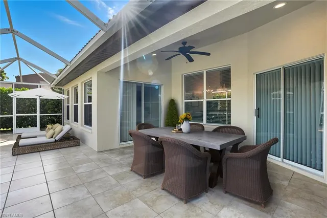 a view of a patio with a table and chairs