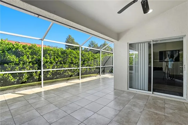 a view of an empty room with sliding glass door